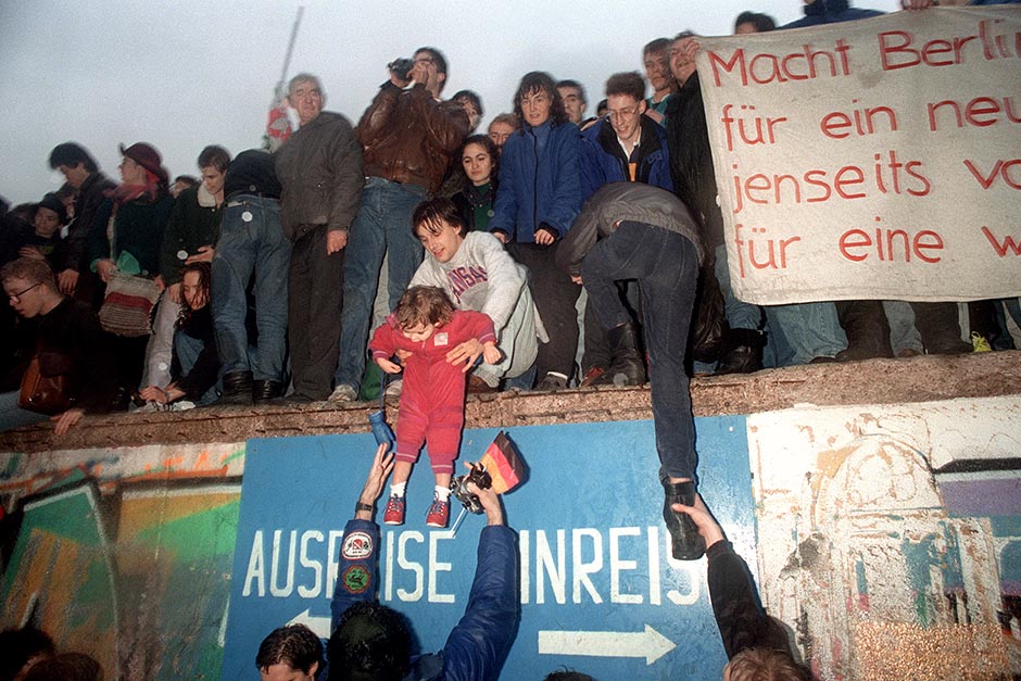 People from East Germany greet West German residents