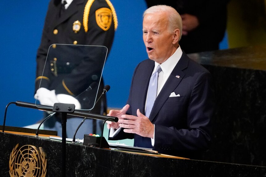 Joe Biden speaks at a lectern. 