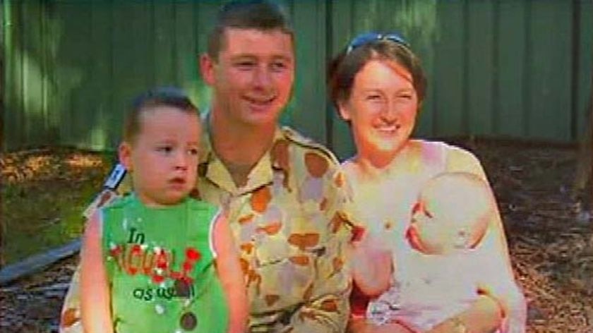 Private Jake Kovco poses with his family. (File photo)