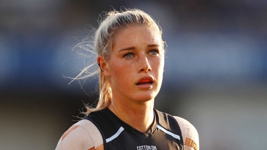 Tayla Harris in Carlton kit looks on during an AFLW match