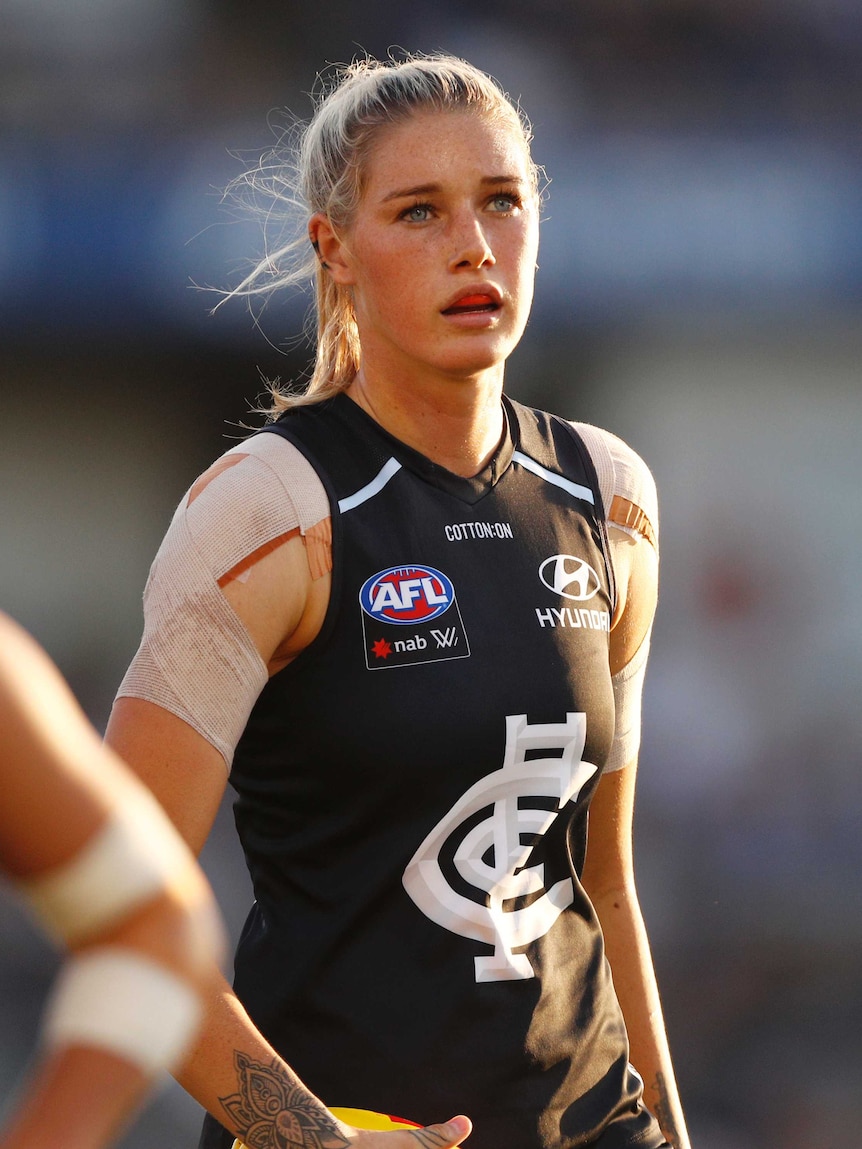 Tayla Harris in Carlton kit looks on during an AFLW match