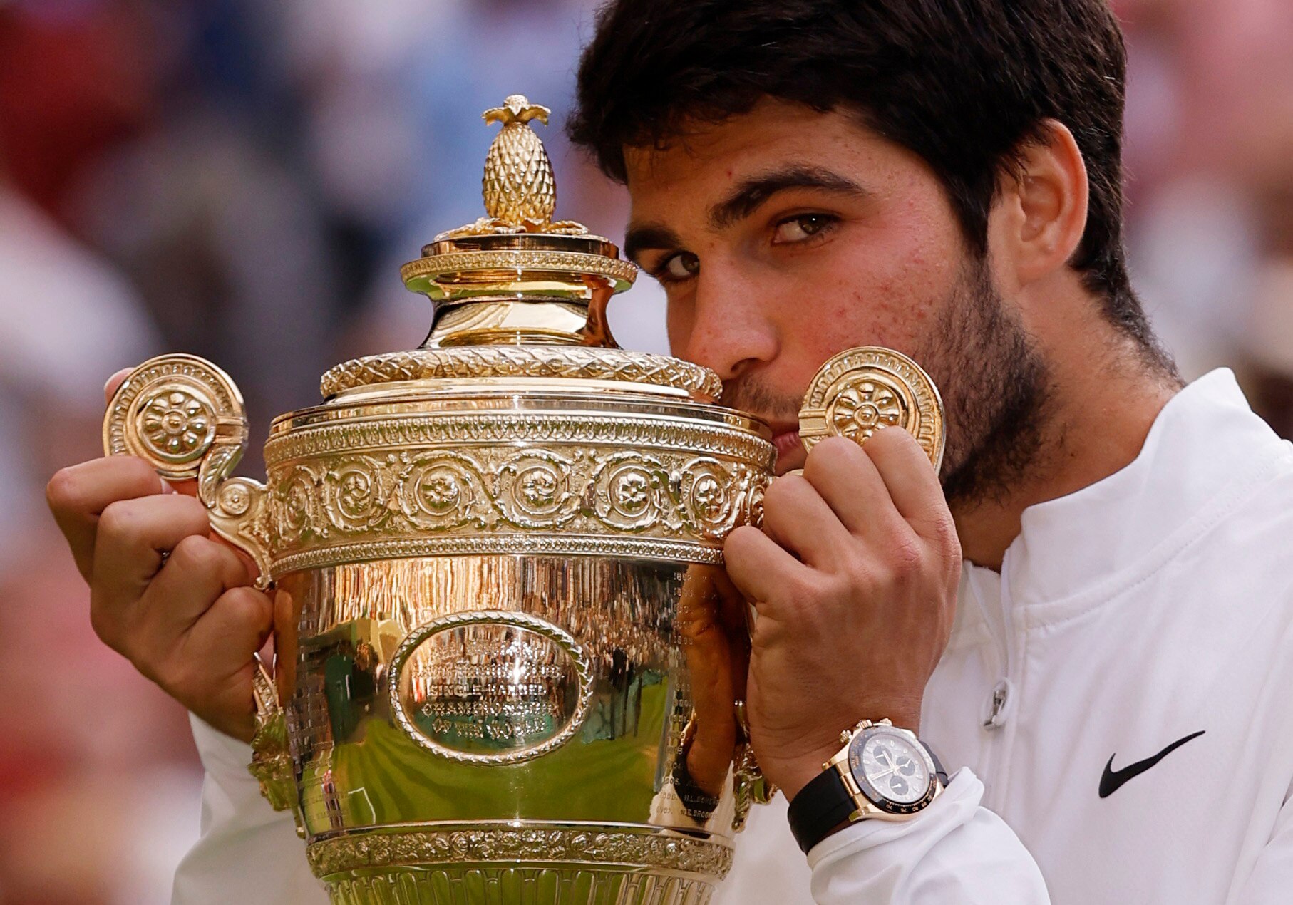 Spain's Carlos Alcaraz celebrates with the trophy after winning his final match against Serbia's Novak Djokovic.