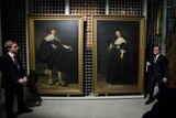 Rembrandt's portraits of Maerten Soolmans and Oopjen Coppit being displayed to the media in Paris.