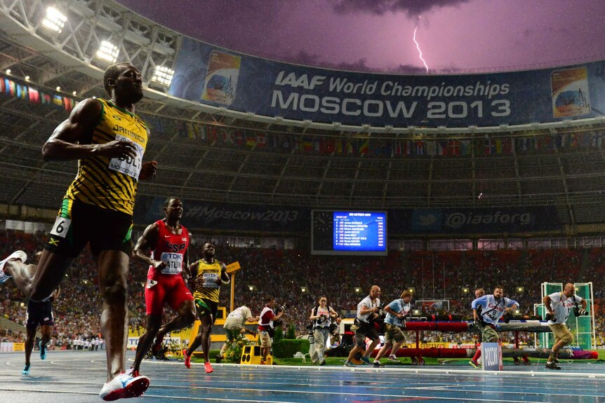 A lightning bolt flashes over Luzhniki stadium in Moscow as Usain Bolt wins the 100m final at the IAAF world championships.