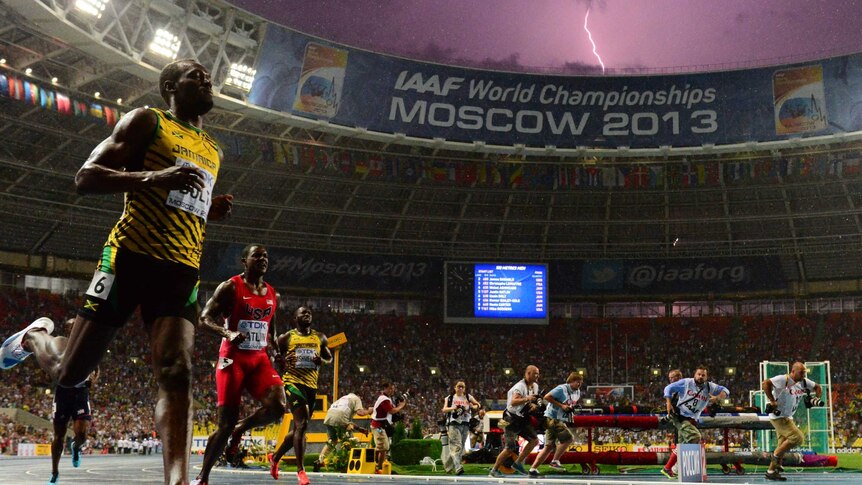 A lightning bolt flashes over Luzhniki stadium in Moscow as Usain Bolt wins the 100m final at the IAAF world championships.