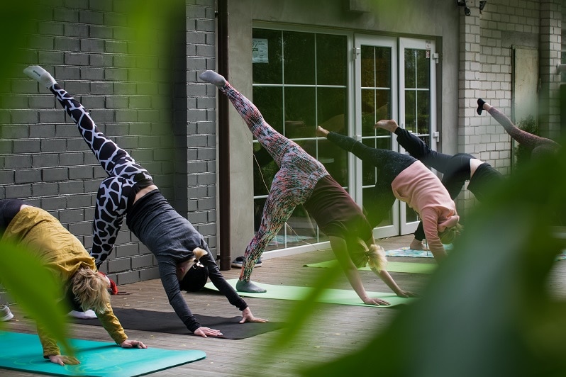 A group of women doing yoga.