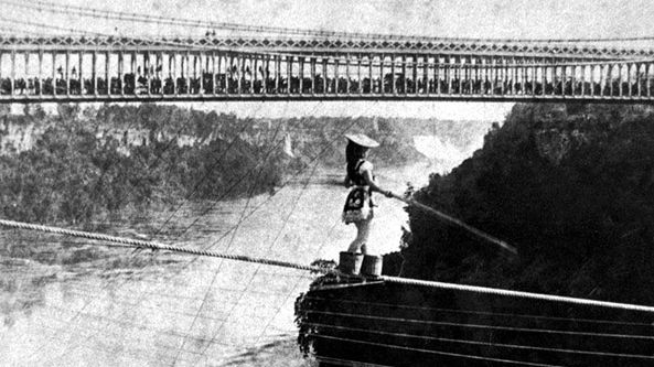 Maria Spelterini walks a tightrope over the Niagara Gorge in 1876