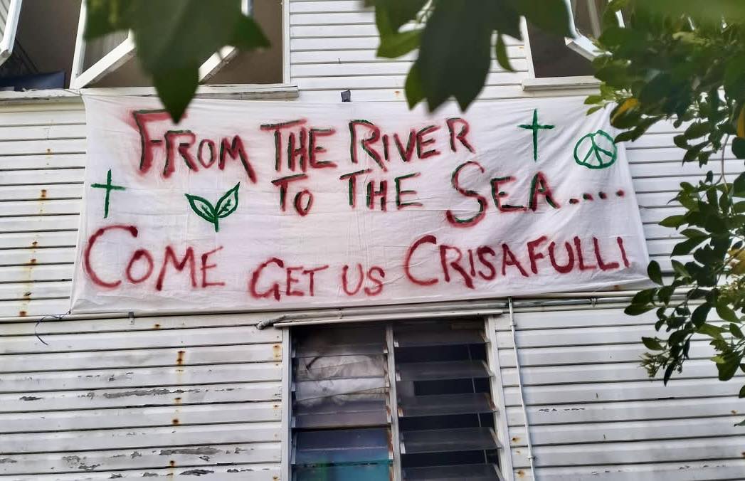 Queensland police raid Christian organisation over pro-Palestine banner