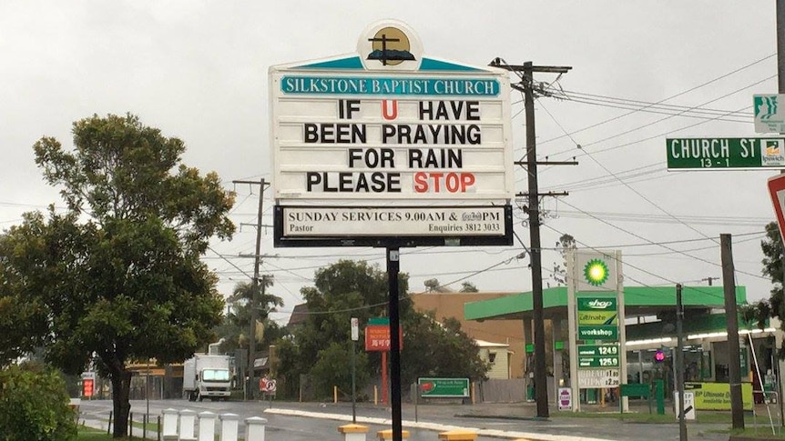 An Ipswich church sign asks residents to stop praying for rain.