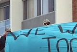 Protesters on roof of Chris Bowen's electorate office