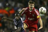 Steven Gerrard of Liverpool battles for the ball with Rio Antonio Mavuba of Bordeaux.