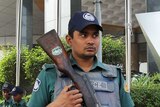 Police stand guard outside the Westin Hotel in Dhaka where Australia's national football team is staying
