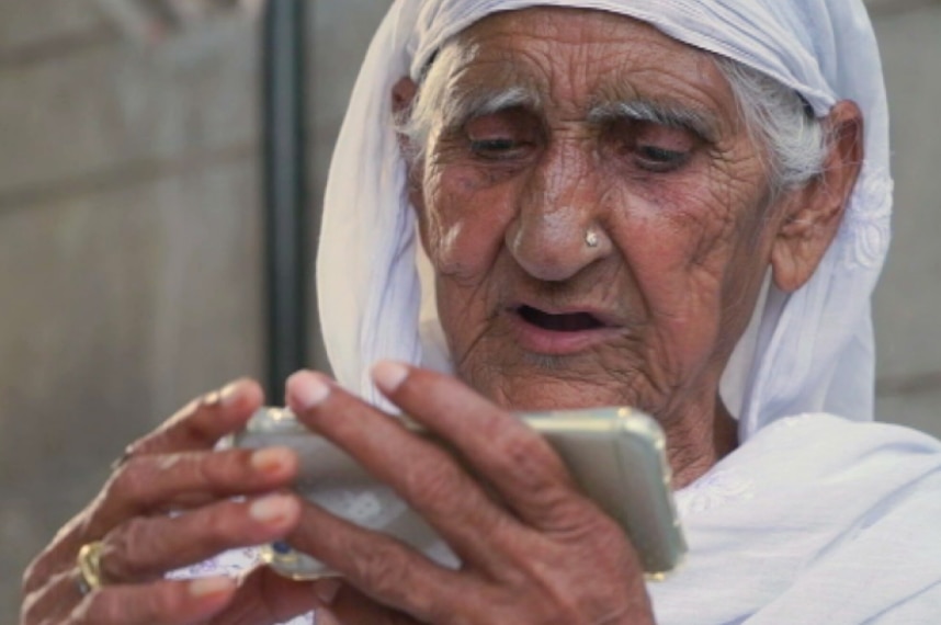 Mahinder Kaur speaks to her brothers during a video call.