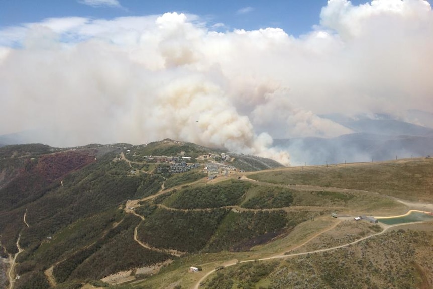 Smoke from a bushfire billows over Hotham Heights Village in the Victorian Alps.