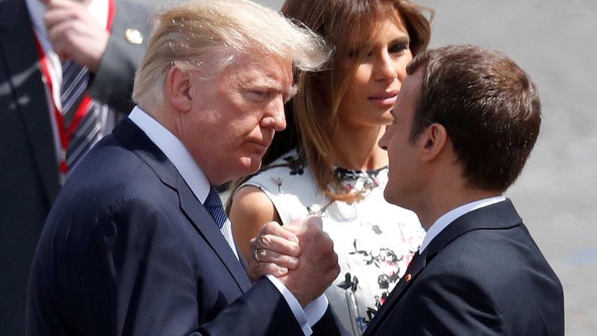 Donald Trump and Emmanuel Macron shake hands