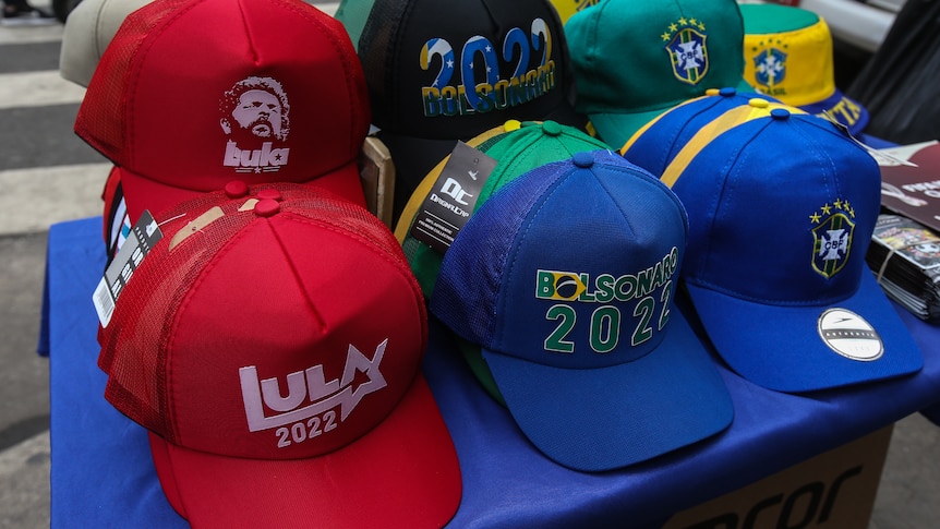 Caps promoting Brazil's presidential candidates Bolsonaro and Lula are displayed 