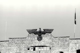 A gate topped with the Eagle and Swastika of Germany's Third Reich pictured at Mauthausen, Austria's largest concentration camp.