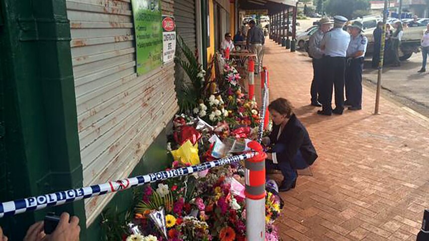 Acting Premier Jackie Trad laid some flowers outside the cafe in Ravenshoe on Wednesday morning.