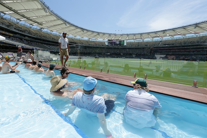 Spectators sit in the pool at Perth Stadium
