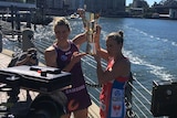 Firebirds captain Laura Geitz and Swifts captain Kimberlee Green with the trans-Tasman netball trophy