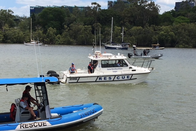 Volunteer marine rescue boats help in search for missing man in Brisbane River.