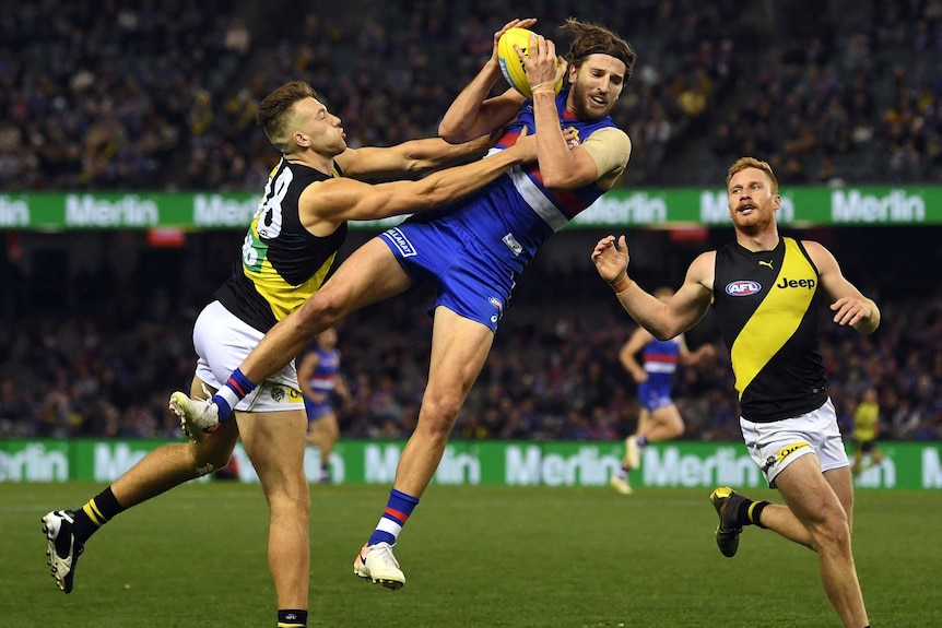 Marcus Bontempelli takes a mark against Richmond