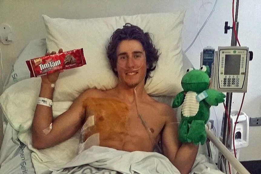 Callum Watson in a hospital bed.