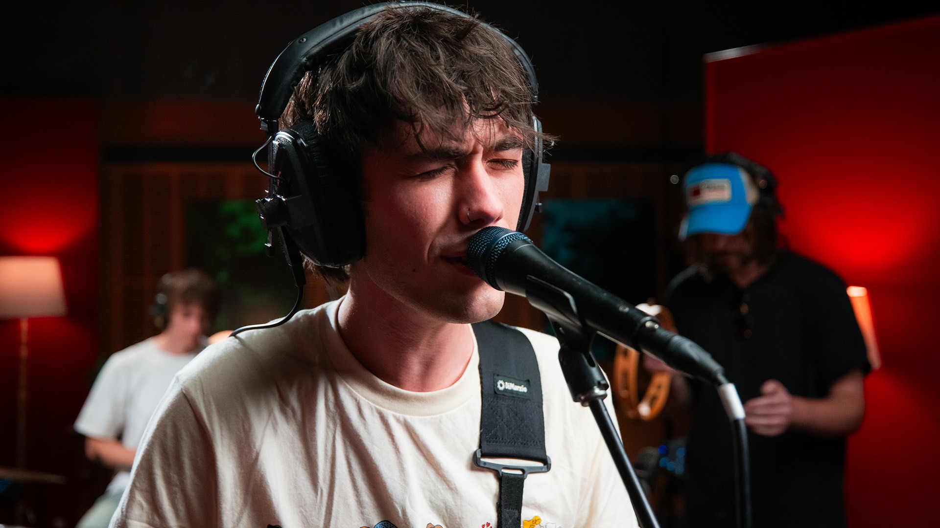 Lead singer singing into a microphone in the Like A Version studio