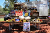 Picnic table covered in food donated by prisoners.