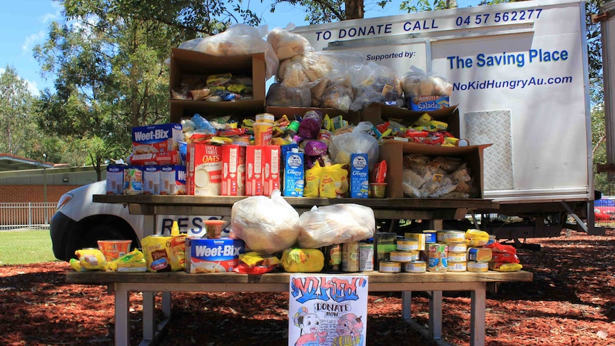 Picnic table covered in food donated by prisoners.