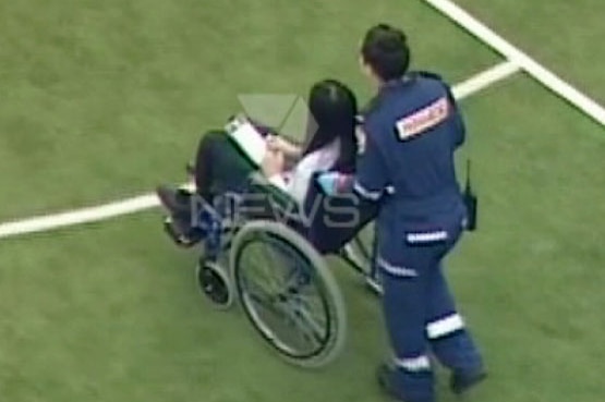 Injured student taken away in wheelchair