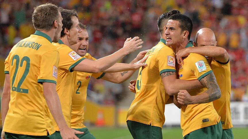 Tim Cahill and the Socceroos celebrate a goal