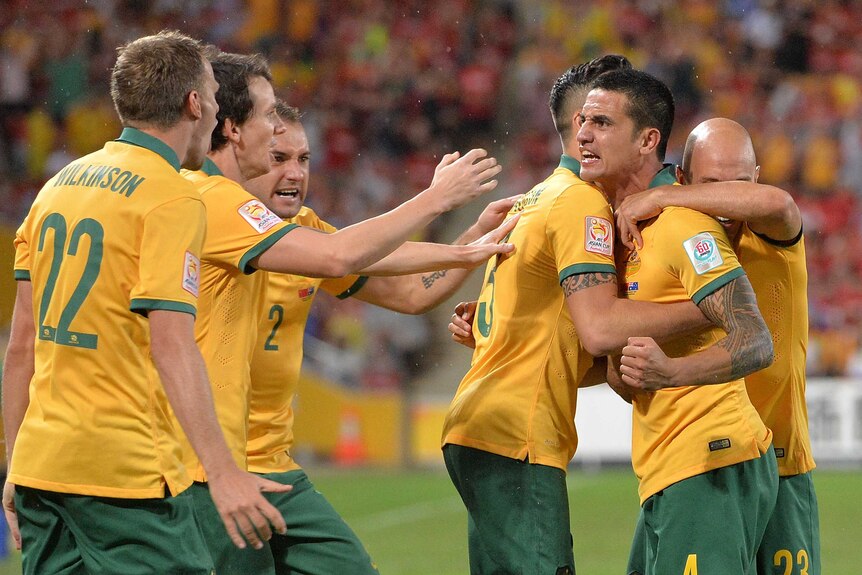 Tim Cahill and the Socceroos celebrate a goal