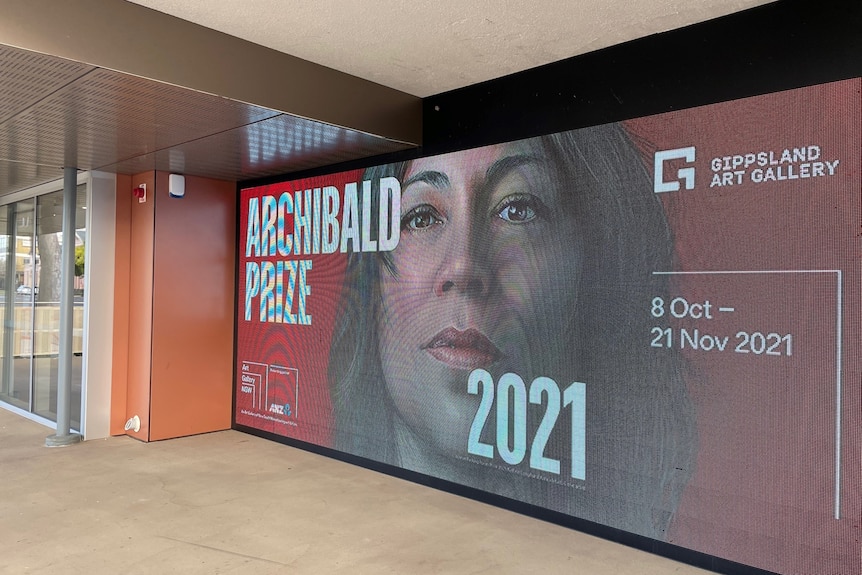 Electronic billboard advertising the Archibald exhibition at Gallery Entrance 