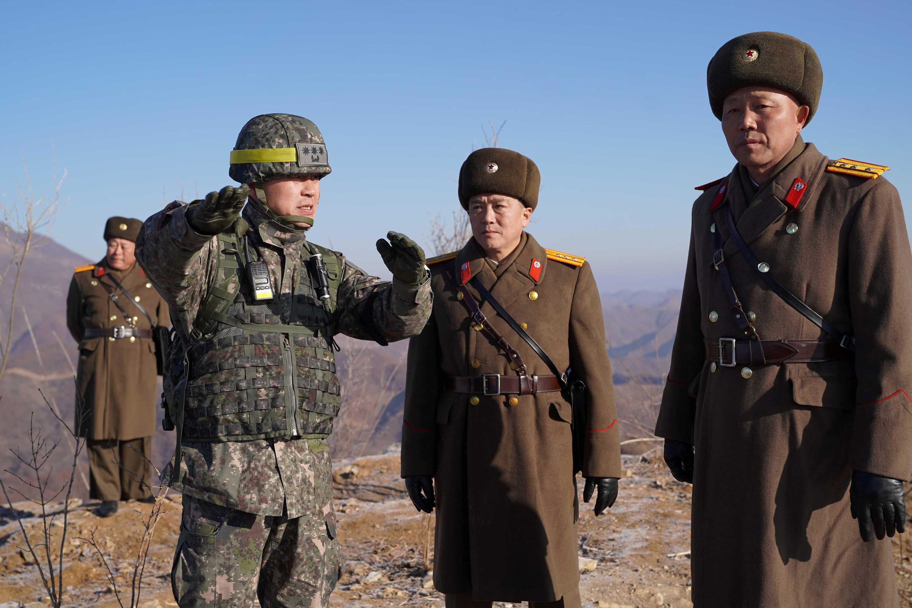 North And South Korean Soldiers Shake Hands, Exchange Cigarettes During ...