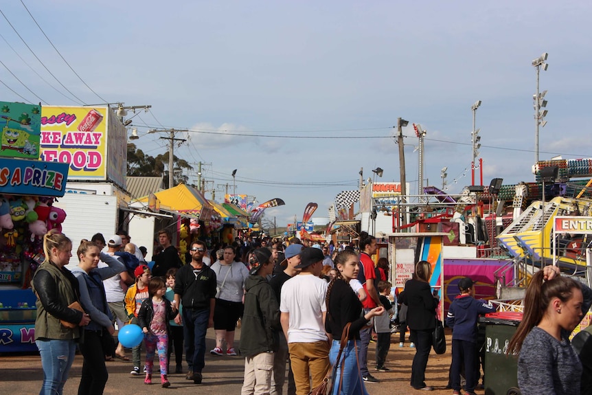 A crowd of people at an agricultural show