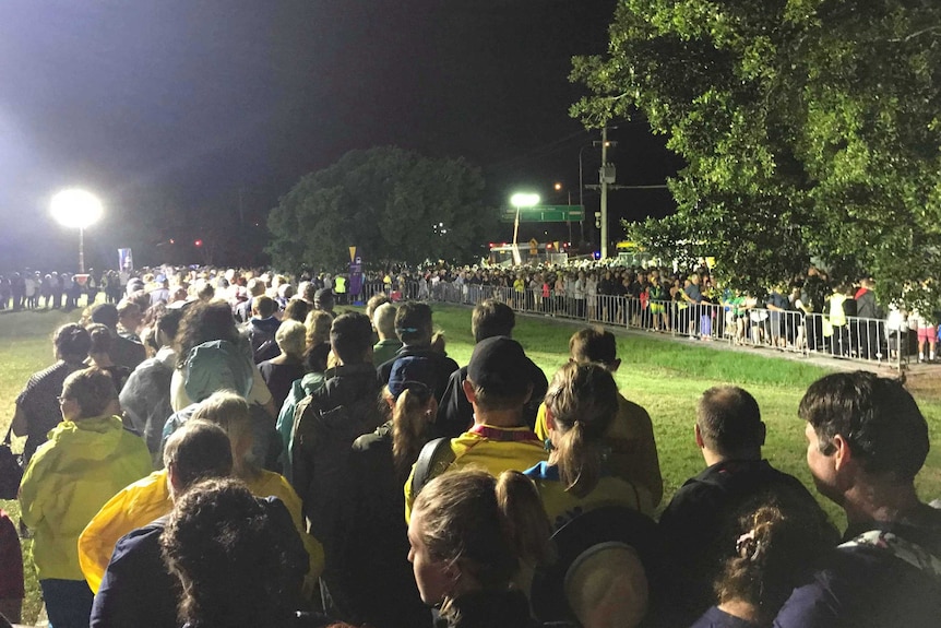 A long line of people waiting for buses after the Commonwealth Games opening ceremony shortly after midnight on April 5, 2018.