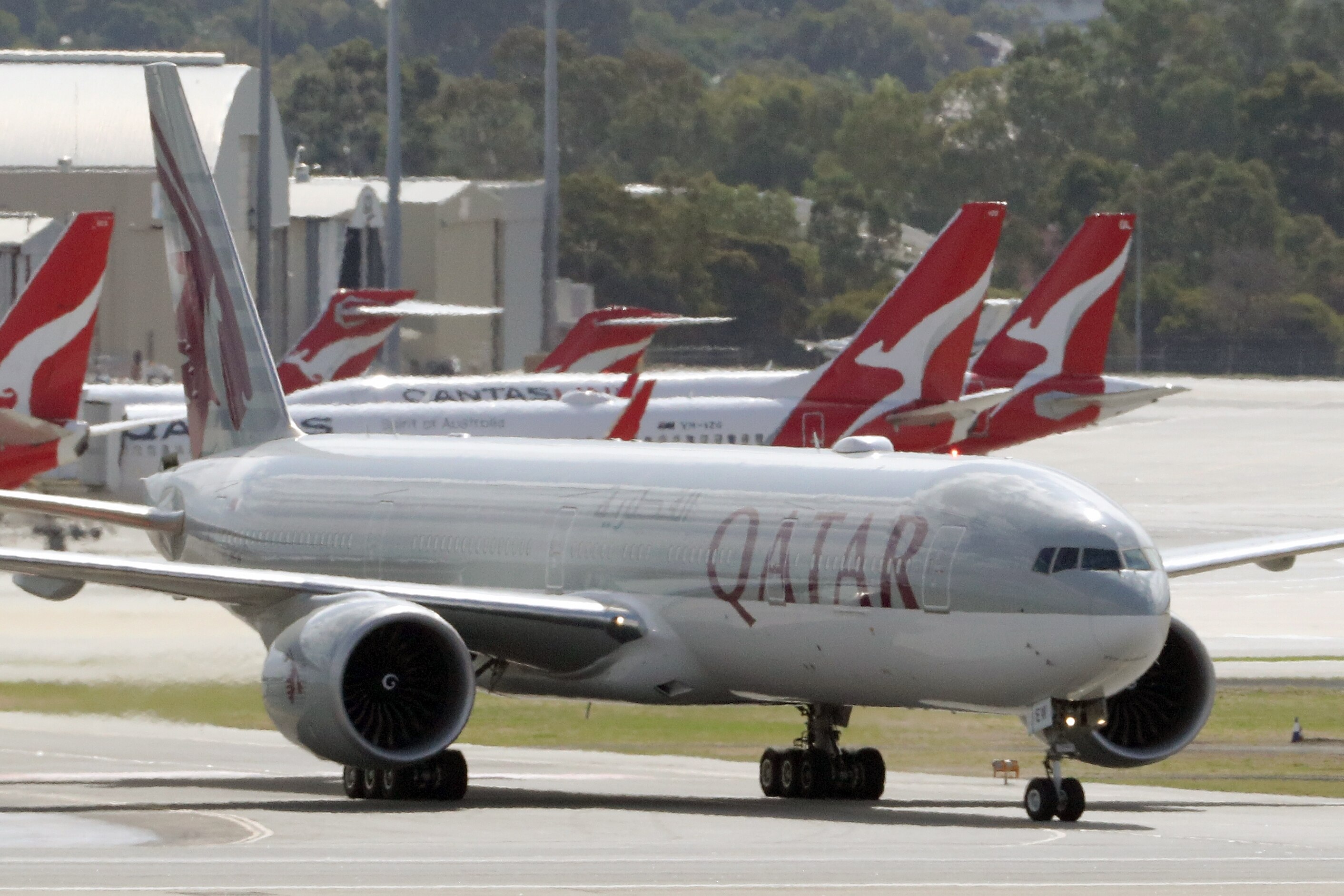 Qatar Airways and Qantas planes on tarmac in Perth.