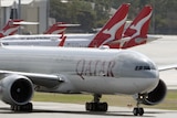 Qatar Airways and Qantas planes on tarmac in Perth.