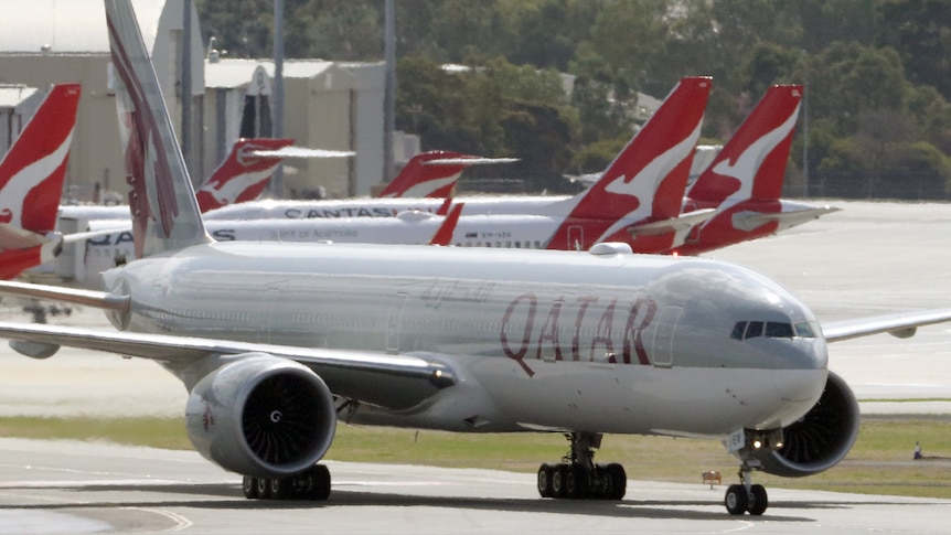 Qatar Airways and Qantas planes on tarmac in Perth.