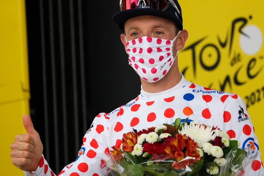 Canada's Michael Woods wears the best climber's dotted jersey
