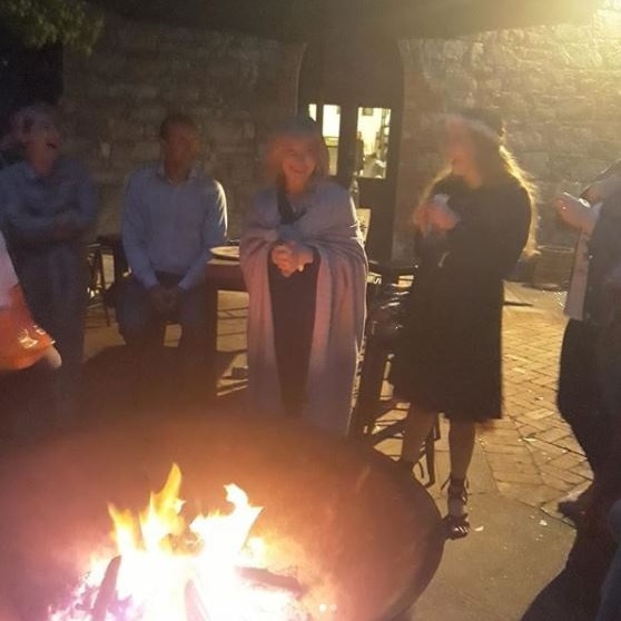 people gathered around a firepit