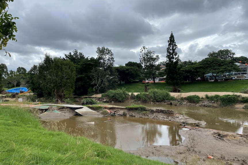 A damaged bikeway covered in water