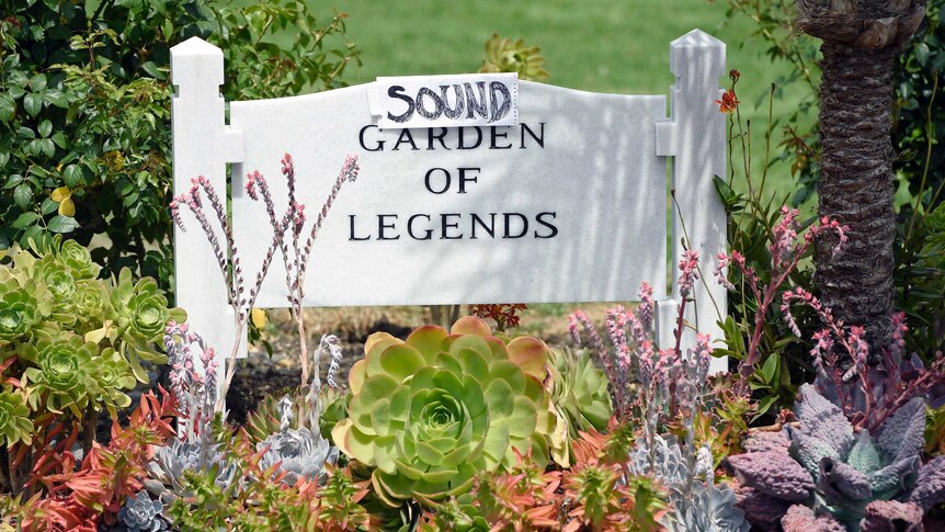 A sign reading "sound garden of legends" at a Hollywood cemetery.