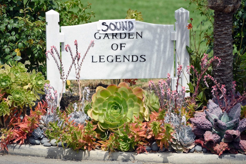 A sign reading "sound garden of legends" at a Hollywood cemetery.