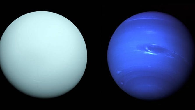 Photos of Uranus and Neptune, captured by Voyager 2, side by side. Uranus is pale blue. Neptune's great dark spot is visible.