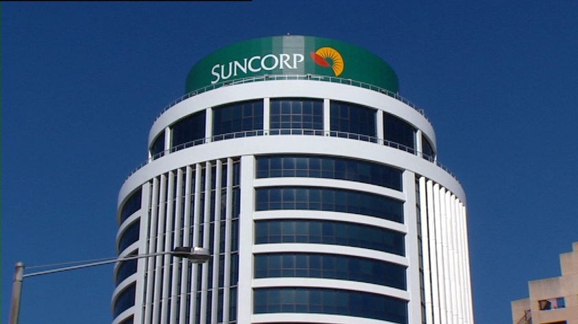 TV still of Suncorp sign on top of building in Qld.