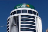 Suncorp sign on top of building in Qld.