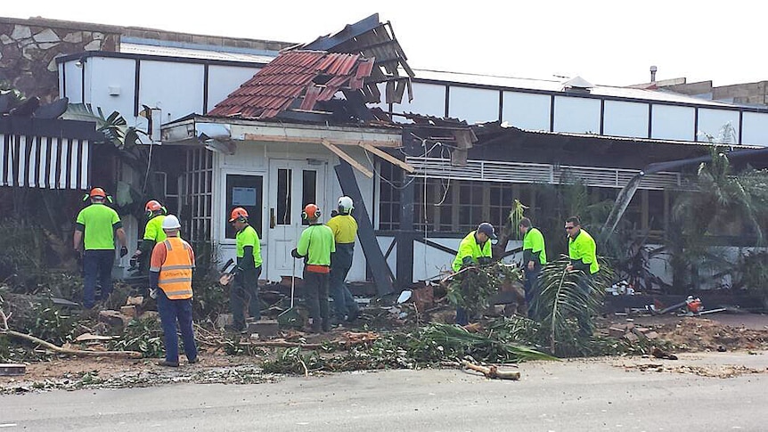 Emergency crews clean up the damage outside Singapore House restaurant in Adelaide.