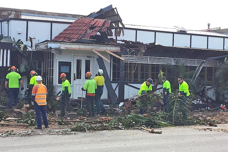 Emergency crews clean up the damage outside Singapore House restaurant in Adelaide.